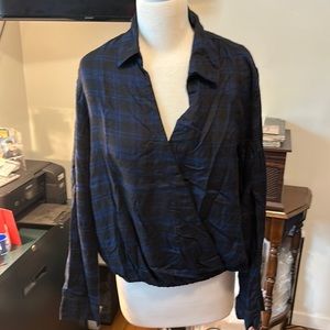 Super cute blue and black plaid high low blouse.